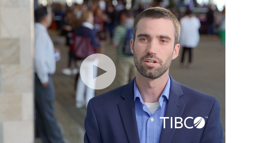 A still of a video featuring Tim Noble, Marketing Program Specialist at TIBCO Software with a play icon superimposed on top of the whole image.
